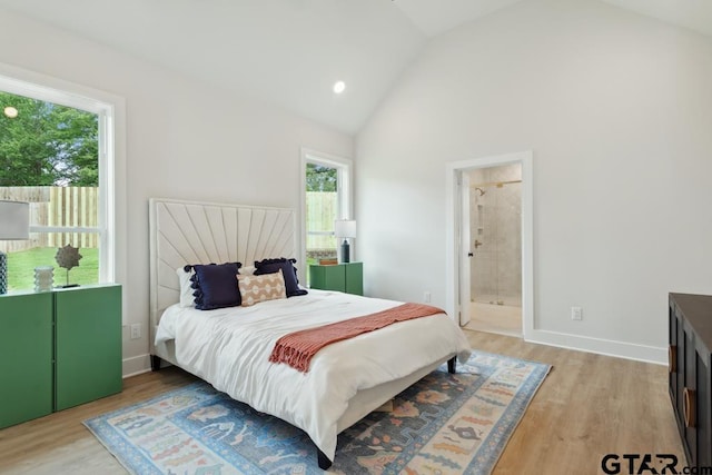 7201 Rolling Acres, Tyler, TX 75707 - bedroom with light wood-type flooring, baseboards, high vaulted ceiling, and connected bathroom