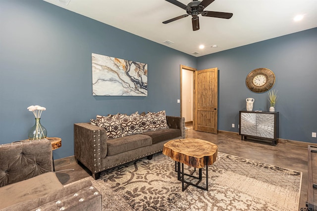 1490 Fm 13 E, Troup, TX 75789 - living area featuring a ceiling fan, concrete flooring, and baseboards
