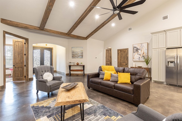 1490 Fm 13 E, Troup, TX 75789 - living room featuring arched walkways, ceiling fan, finished concrete floors, high vaulted ceiling, and beamed ceiling