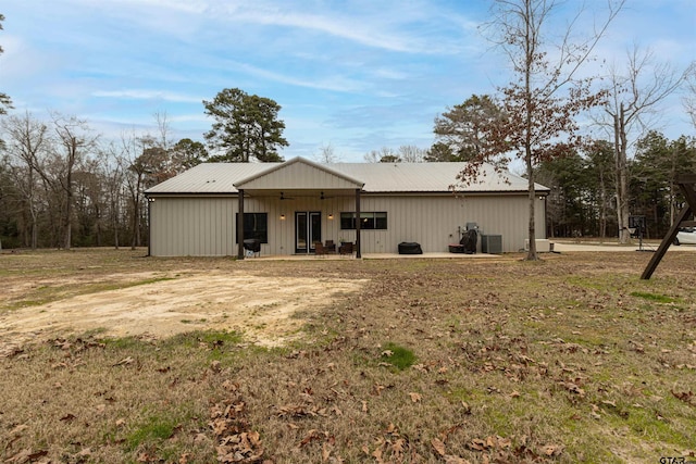 1490 Fm 13 E, Troup, TX 75789 - rear view of house featuring metal roof and cooling unit