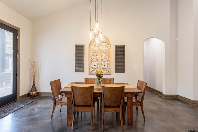 1490 Fm 13 E, Troup, TX 75789 - dining room with finished concrete floors, arched walkways, and baseboards