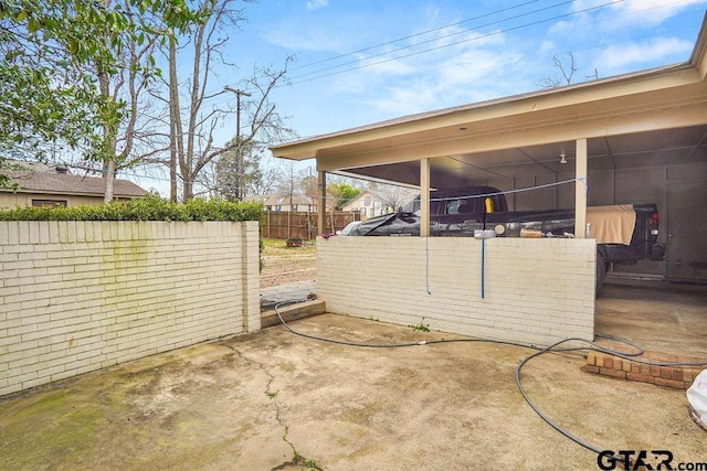 view of patio / terrace featuring a sunroom