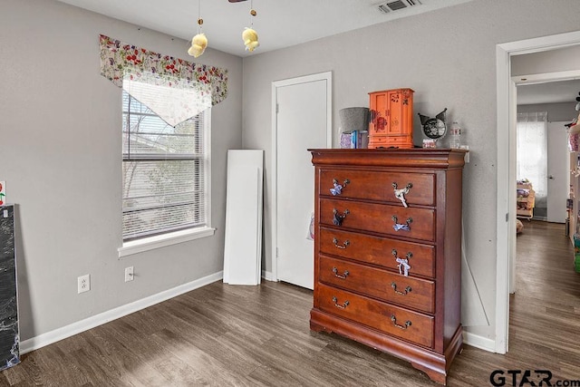 bedroom featuring dark wood-type flooring