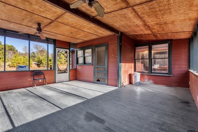 unfurnished sunroom with ceiling fan and wood ceiling