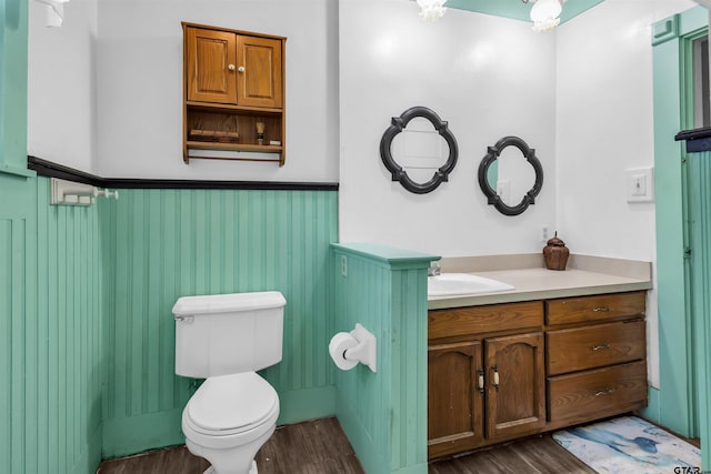 bathroom featuring hardwood / wood-style floors, vanity, and toilet