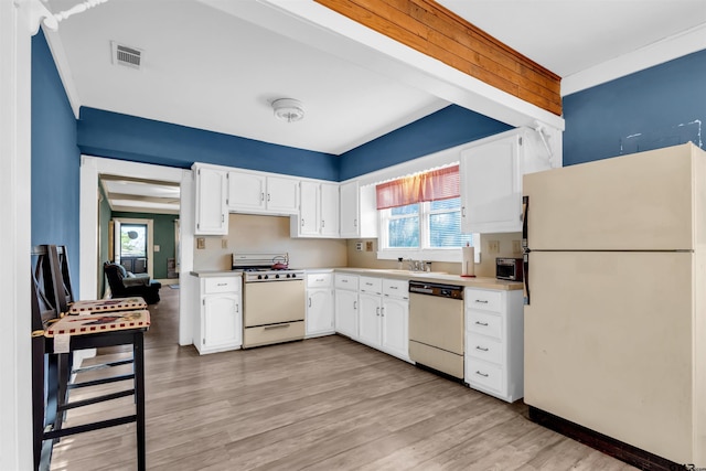 kitchen featuring white cabinets, white appliances, light hardwood / wood-style floors, and sink