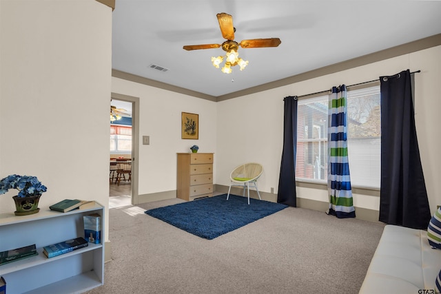 sitting room with light carpet and ceiling fan