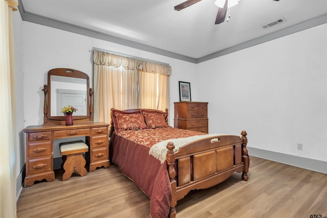 bedroom with ceiling fan and light wood-type flooring