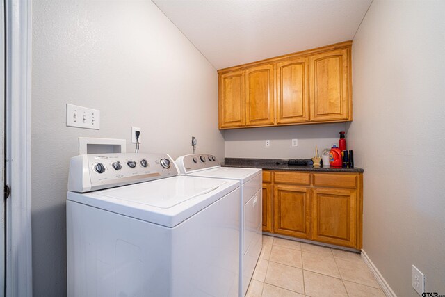 1831 Scarlet Oak Rd, Gilmer, TX 75645 - laundry room featuring light tile patterned floors, washing machine and clothes dryer, cabinet space, and baseboards