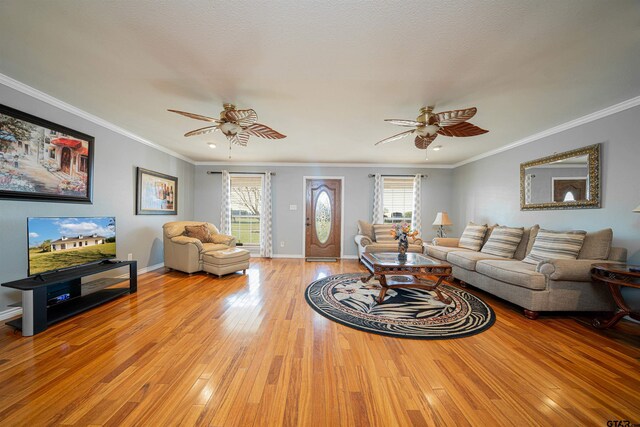 1831 Scarlet Oak Rd, Gilmer, TX 75645 - living room featuring ceiling fan, plenty of natural light, and light wood-style flooring