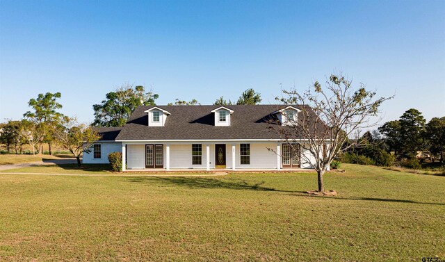 1831 Scarlet Oak Rd, Gilmer, TX 75645 - cape cod home with roof with shingles, a porch, and a front yard