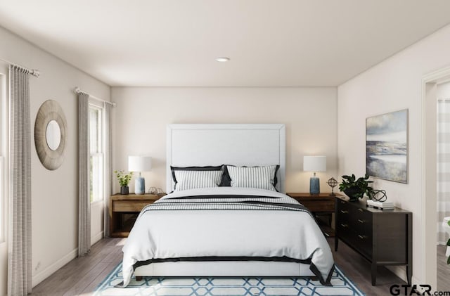 bedroom with wood-type flooring