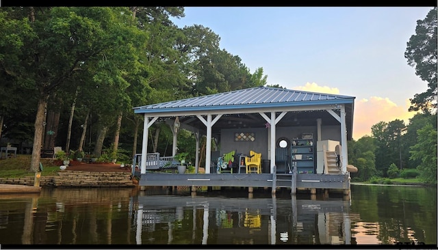 view of dock with a water view and a gazebo