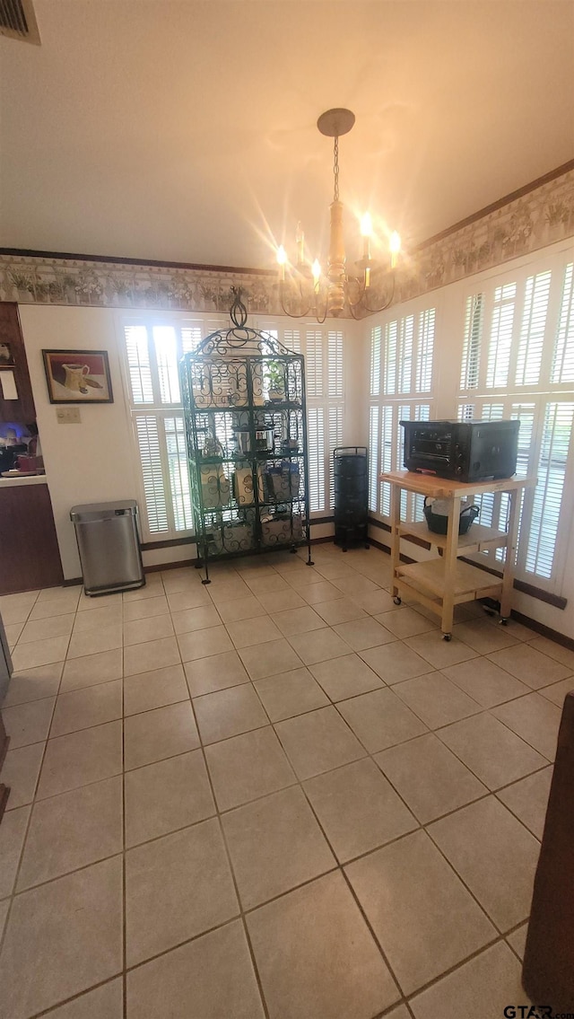 3802 Allendale Dr, Tyler, TX 75701 - dining area with a chandelier and light tile patterned flooring