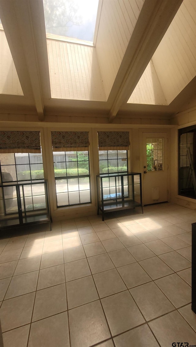 3802 Allendale Dr, Tyler, TX 75701 - empty room with tile patterned flooring, beamed ceiling, and high vaulted ceiling