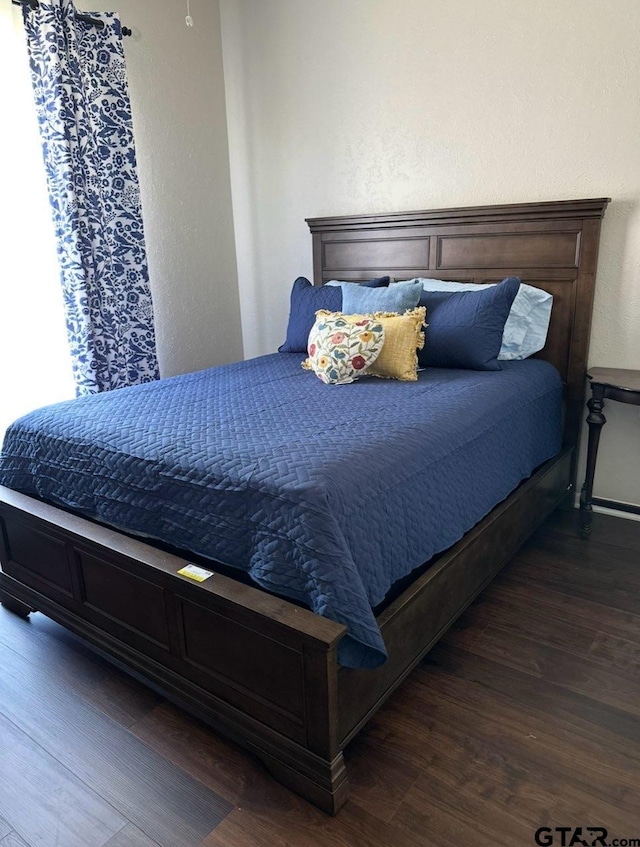 3802 Allendale Dr, Tyler, TX 75701 - bedroom featuring wood finished floors and a textured wall