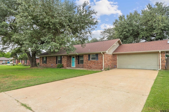 single story home with a garage and a front yard