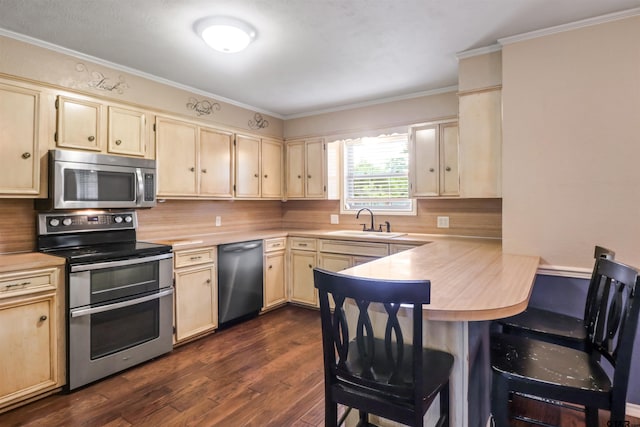 kitchen featuring dark hardwood / wood-style flooring, decorative backsplash, sink, and stainless steel appliances