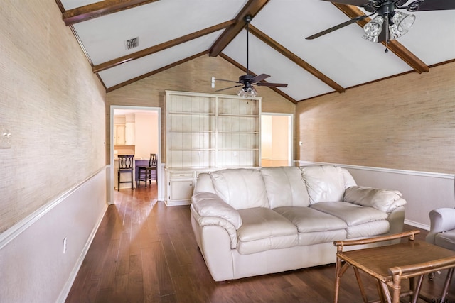 living room featuring dark hardwood / wood-style flooring, beamed ceiling, and ceiling fan