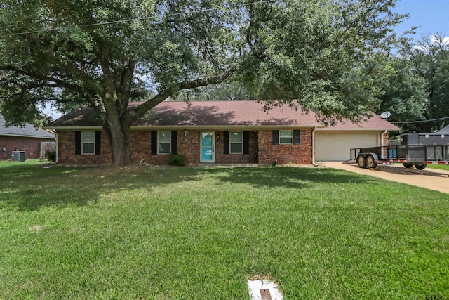 single story home featuring a front lawn, a garage, and central AC