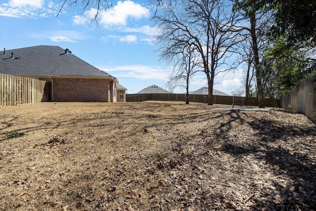 view of yard featuring a fenced backyard