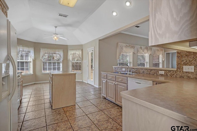 kitchen with visible vents, a kitchen island, a sink, ceiling fan, and white appliances