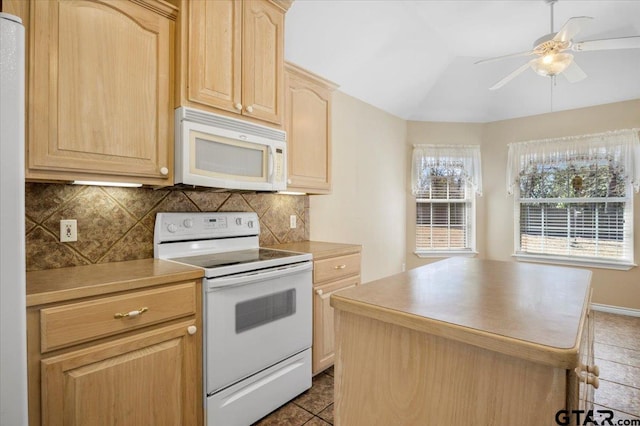 kitchen with white appliances, a kitchen island, light brown cabinets, and decorative backsplash