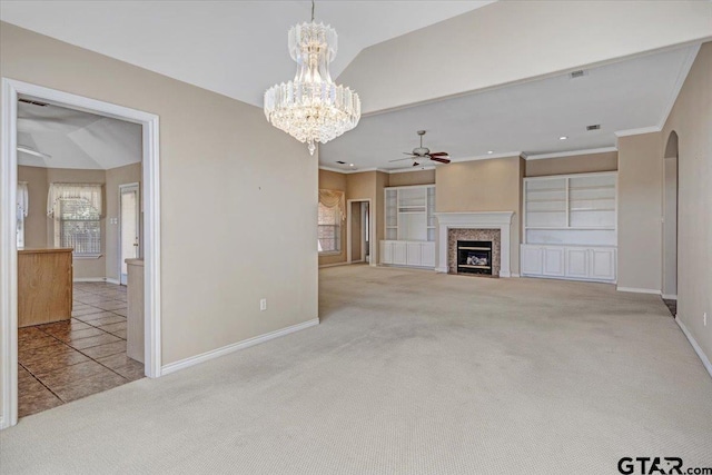 unfurnished living room featuring a fireplace with flush hearth, carpet, crown molding, and baseboards