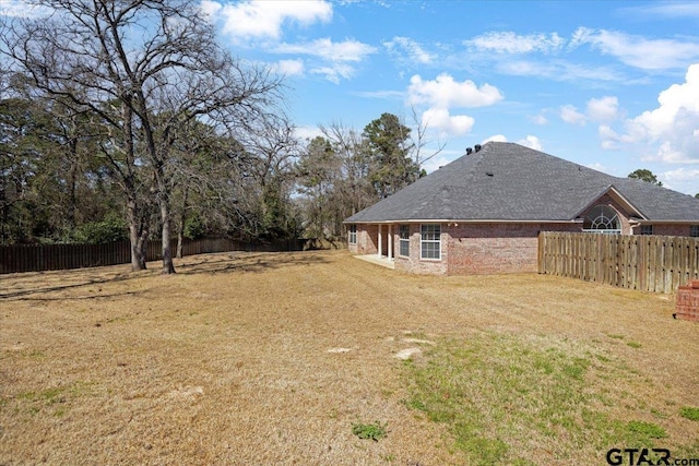 view of yard featuring a fenced backyard