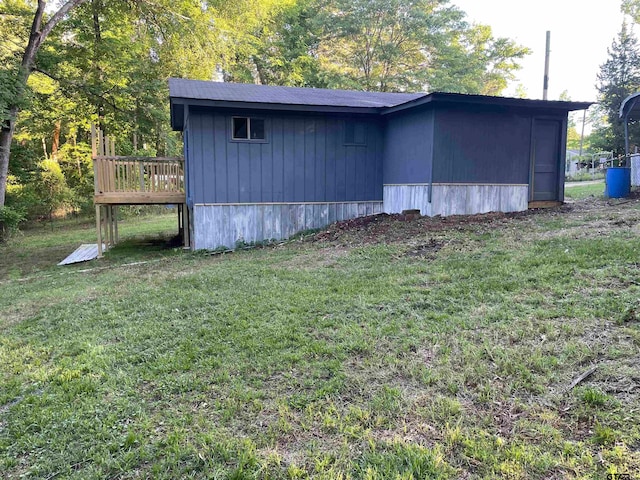 view of outdoor structure featuring a lawn