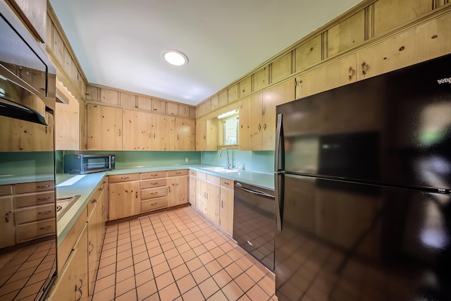 2929 Dinah Ln, Tyler, TX 75701 - kitchen with light brown cabinets, black appliances, light countertops, and light tile patterned floors