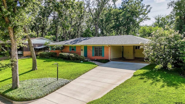 2929 Dinah Ln, Tyler, TX 75701 - ranch-style house with an attached carport, driveway, brick siding, a front lawn, and a shingled roof