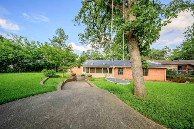 2929 Dinah Ln, Tyler, TX 75701 - ranch-style home with a front lawn, brick siding, and roof with shingles