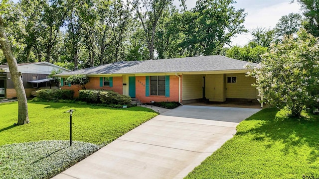 2929 Dinah Ln, Tyler, TX 75701 - single story home featuring a carport, driveway, a front yard, brick siding, and roof with shingles