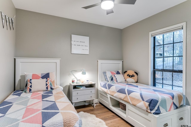 bedroom featuring light wood-style flooring and ceiling fan