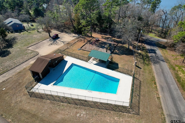 view of swimming pool with fence and a fenced in pool