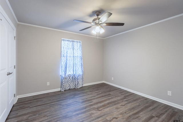 unfurnished bedroom featuring crown molding, ceiling fan, dark wood-type flooring, baseboards, and a closet