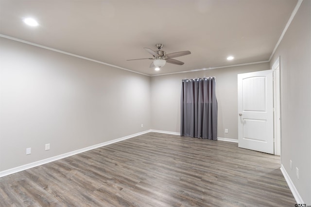 spare room with baseboards, ornamental molding, recessed lighting, wood finished floors, and a ceiling fan