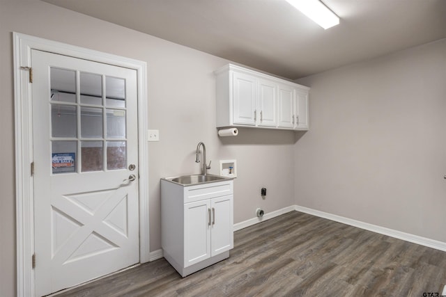 laundry area featuring hookup for an electric dryer, cabinet space, dark wood-style flooring, a sink, and washer hookup