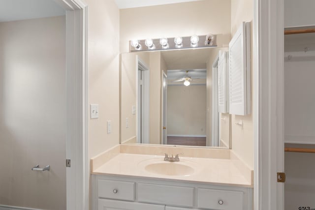 bathroom featuring vanity and ceiling fan