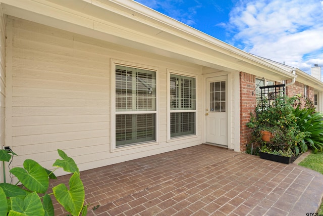 doorway to property with a patio