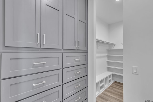 spacious closet featuring light hardwood / wood-style flooring