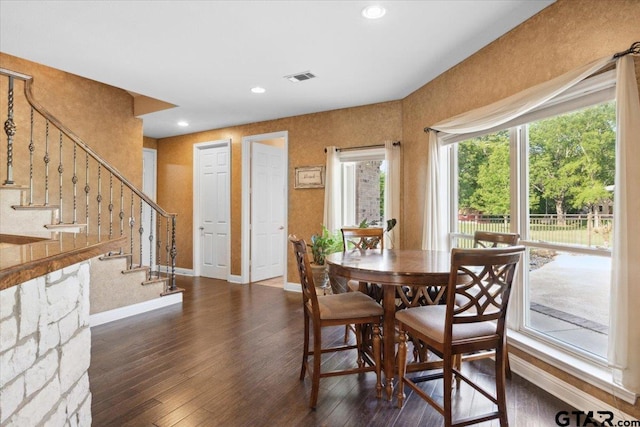 dining space featuring dark hardwood / wood-style flooring