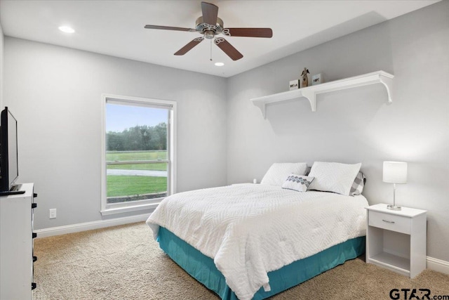 carpeted bedroom with ceiling fan