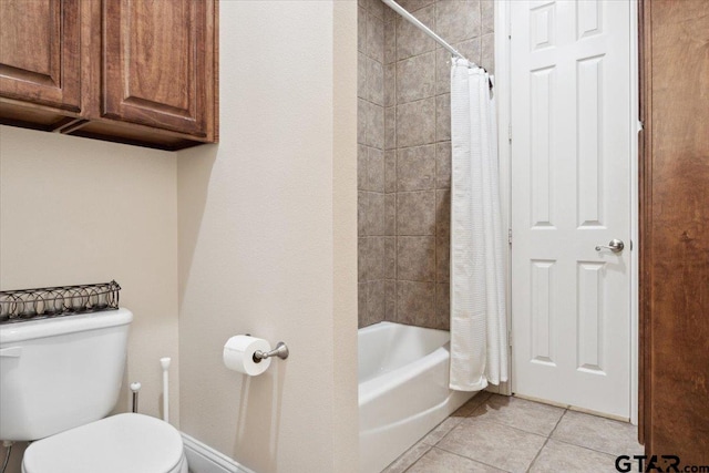 bathroom with toilet, tile patterned floors, and shower / bathtub combination with curtain