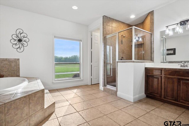 bathroom with vanity, tile patterned floors, and separate shower and tub