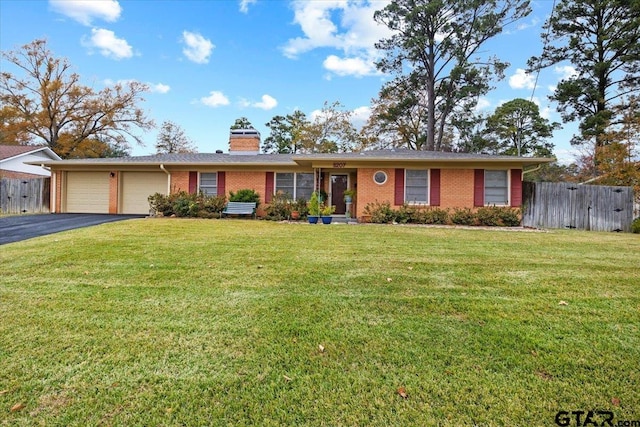 ranch-style house with a front yard and a garage