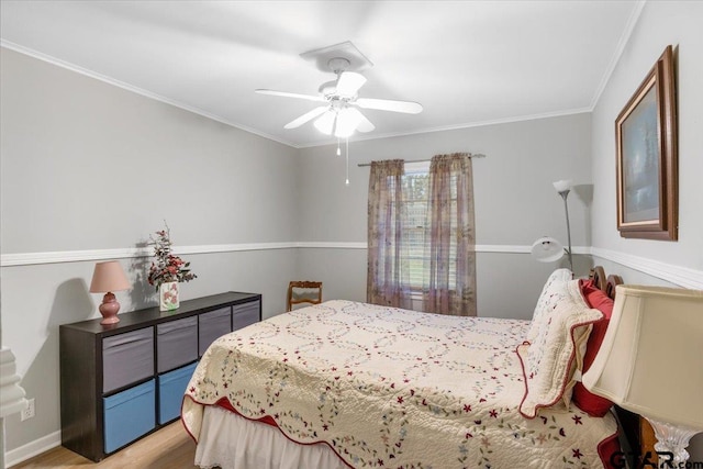 bedroom featuring ceiling fan, light hardwood / wood-style flooring, and ornamental molding