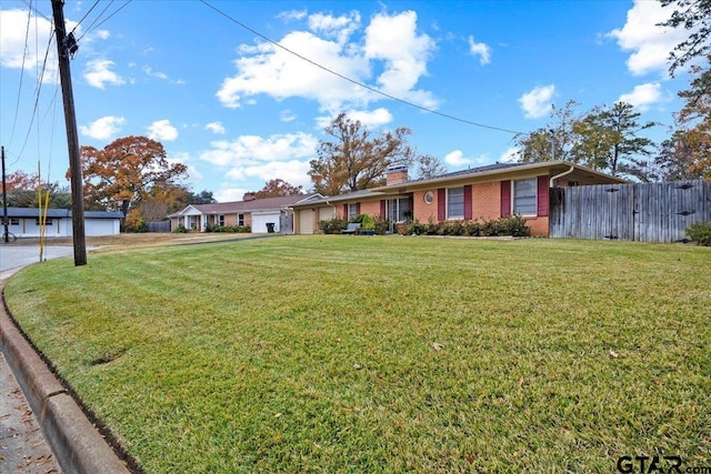 ranch-style house featuring a front lawn