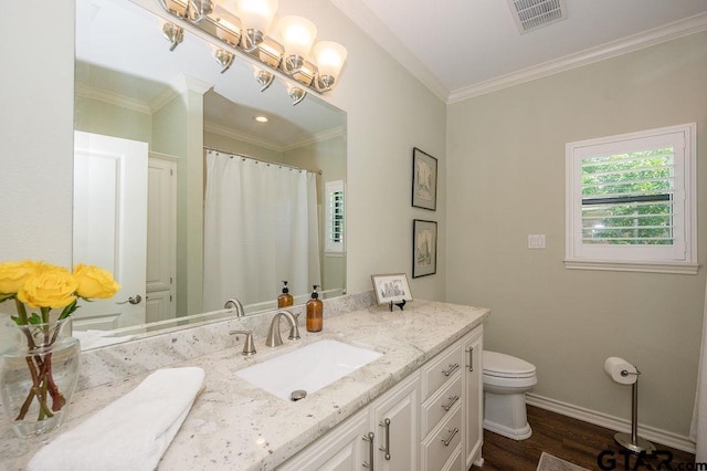 full bathroom featuring visible vents, baseboards, toilet, ornamental molding, and vanity